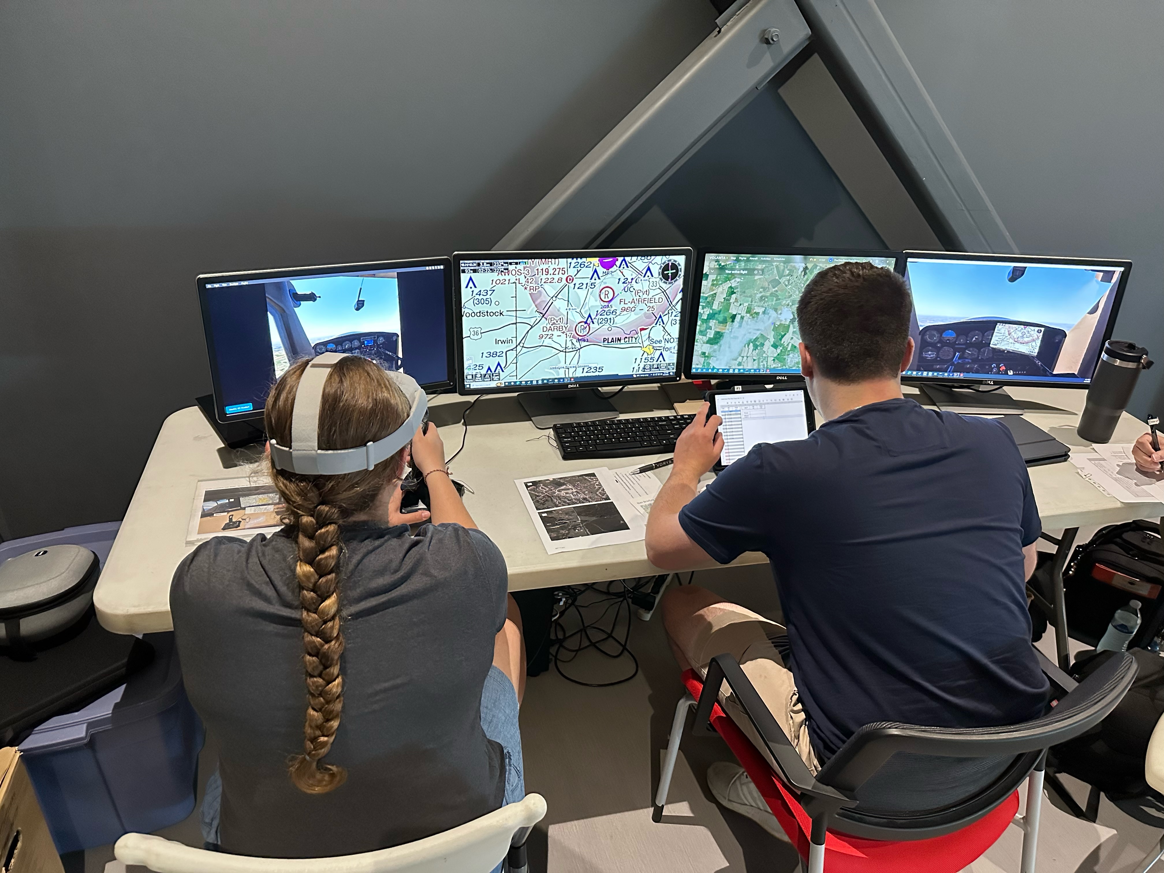 Dispatch students planning flights in a university classroom